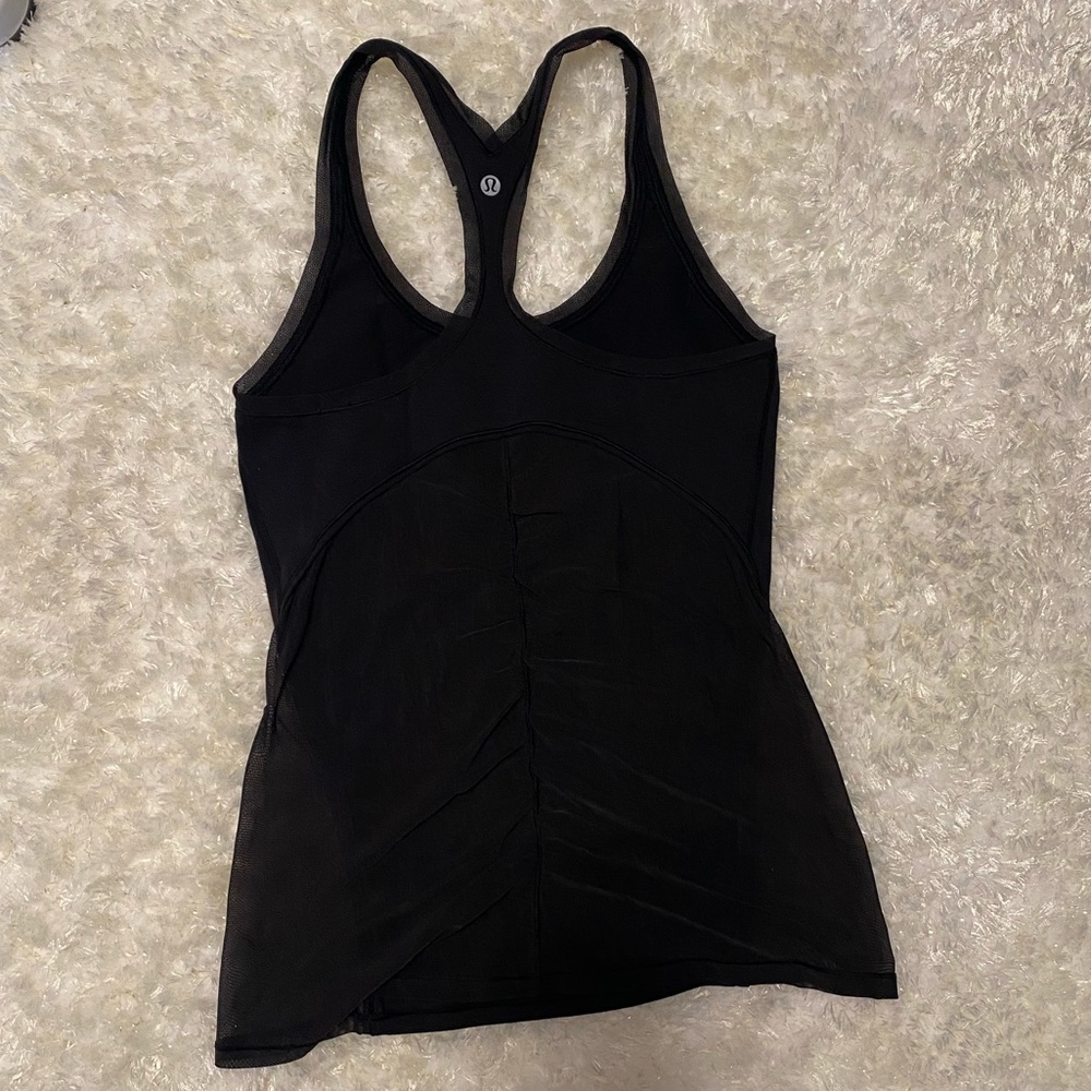 Black Lulu lemon workout tank with mesh detailing in back